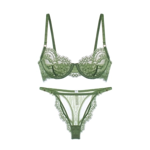 Deep green lace lingerie set with sheer floral embroidery and adjustable thong