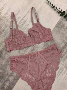 Detail of grey-pink lace lingerie set with floral embroidery and high-waist panty