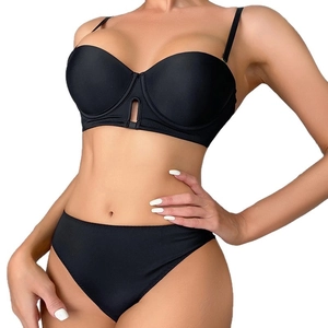 Seamless black push-up bra and panty set with sleek microfiber fabric on model