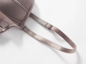 Detail of adjustable straps and satin finish on seamless smokey purple lingerie
