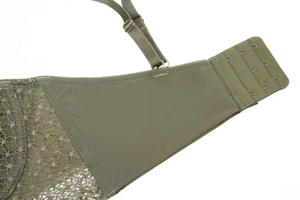 Close-up of olive green lace bra with four-row back closure and adjustable straps