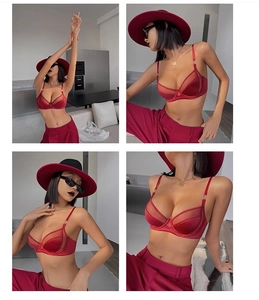 Détail d'un soutien-gorge rouge en maille transparente avec fines bretelles et armatures