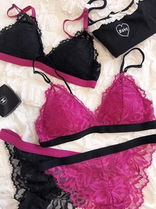 Close-up of delicate eyelash lace lingerie with contrast heart embroidery and soft texture