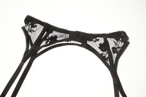 Detailed back view of black lace garter belt with floral embroidery and hook-eye closure