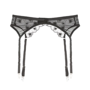 Close-up of black lace garter belt with heart embroidery and adjustable straps