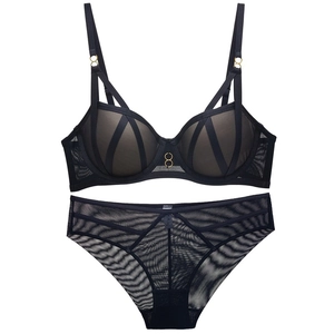 Lace and mesh lingerie set featuring cross-strap bra with gold ring hardware