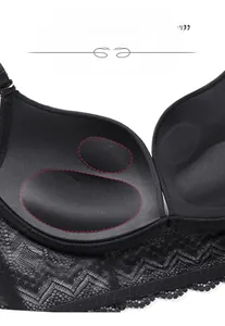 Detailed macro view of black lace bra with thick padded cups for push-up support