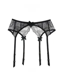 Close-up of black floral lace garter belt with adjustable straps and bow details