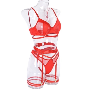 Detail of red hollow mesh lingerie set with lace-up straps and metallic rings