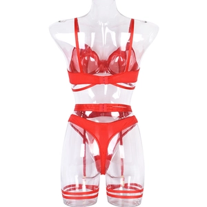 Detail of red mesh lingerie set with wired bra, garter belt and matching thong on mannequin