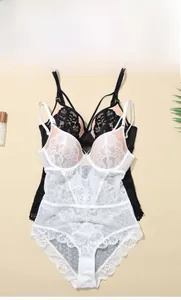 Flat lay of French lace bodysuits featuring floral embroidery and mesh details