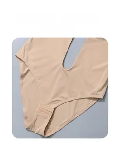 Detail of nude shaping bodysuit showing deep U-back design and bottom snap fasteners
