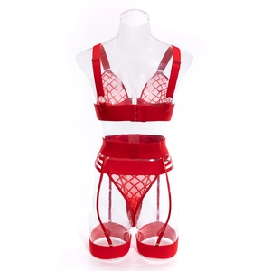 Detailed view of red mesh four-piece lingerie set with strappy harness and garter belts