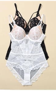 Detail of delicate floral lace and polka dot mesh panels on this elegant bodysuit