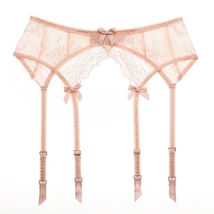 Peach pink lace garter belt featuring floral patterns and adjustable satin ribbon clips