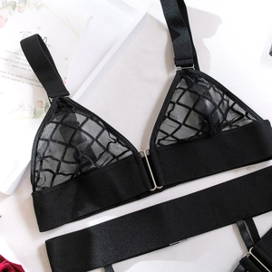 Detail of black mesh lace lingerie set with front buckle and adjustable straps