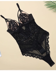 Detail of black floral lace bodysuit with mesh textures and eyelash lace trim