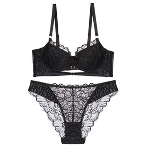 Lace lingerie set with metal ring harness detail and floral embroidery in black color