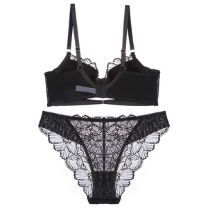 Close-up of black lace lingerie set featuring floral embroidery and scalloped edges