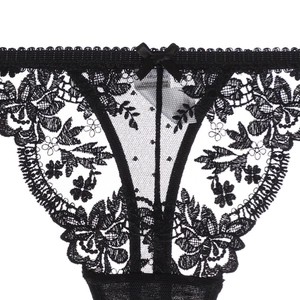 Detailed view of black floral lace panties featuring a delicate bow and sheer mesh texture