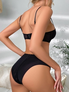 Detailed back view of black lace lingerie set featuring mesh texture and high waist cut