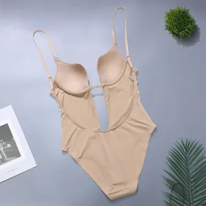 Detail of backless body shaper with detachable straps and deep V neckline in beige