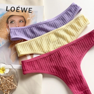 Three-pack waffle texture low-waist thongs in purple, yellow, and rose colors