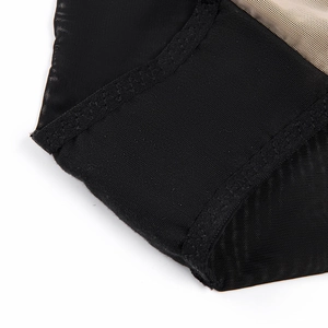 Close-up of breathable black mesh lace with nude honeycomb lining on luxury lingerie