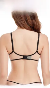 Macro detail of sexy U-shaped open back bra with thin black straps and sheer mesh fabric