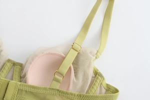 Detailed macro view of French lace bra featuring breathable mesh lining and adjustable straps