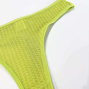 Close-up of lime green waffle weave fabric and neat edge binding for women's panties