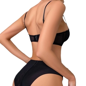 Sexy black mesh cutout push-up bra and high-waisted panty set for women shown on model
