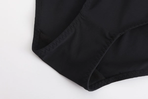 Detail of black seamless mesh underwear showing high-quality stitching and breathable fabric