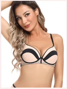 Détail du soutien-gorge beige sans couture avec bordure noire et armatures souples