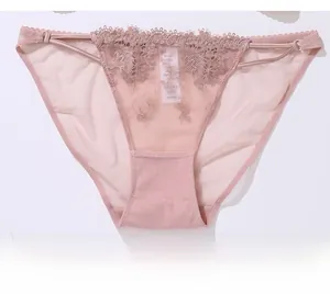 Detailed close-up of pink lace embroidery and breathable mesh on women underwear