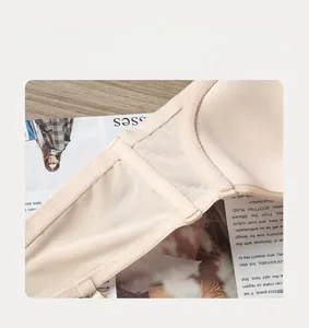 Detail of nude breathable mesh bra side wing with supportive side boning for shaping