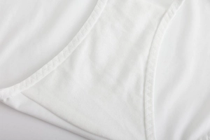 Macro shot of breathable white cotton crotch and flat seam stitching of the panties