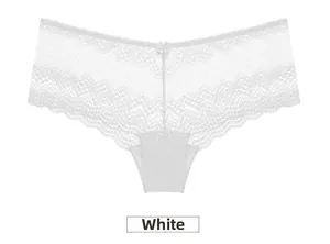 Detail of white lace panties with delicate floral patterns and a small center bow