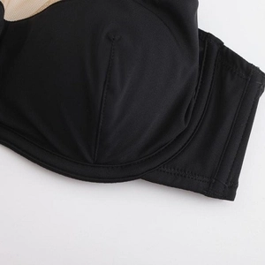 Seamless French style black push-up bra with lace mesh panels and smooth fabric detail