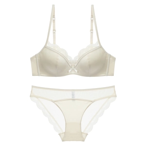 Elegant French style satin and lace lingerie set for women with bow detail in champagne