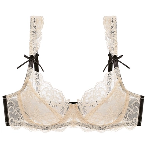 Soutien-gorge en dentelle beige et noir avec broderie florale et petits noeuds