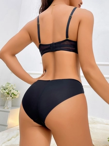 Rear view of black push-up bra set featuring mesh details and adjustable straps