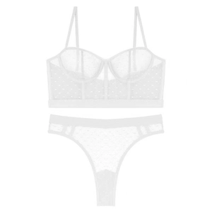 Détail macro du tissu en maille à pois blancs et des baleines d'un ensemble bustier sexy