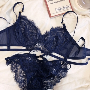 Detail of navy blue lace lingerie set with eyelash trim and delicate mesh paneling