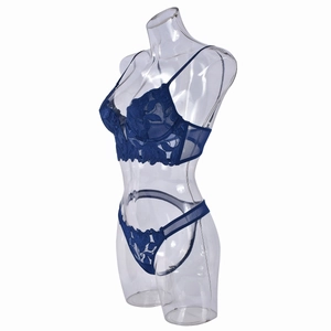 Detail of dark blue lace lingerie set with floral embroidery and sheer mesh wings