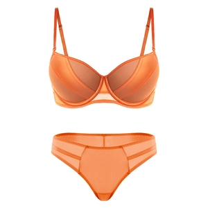 Detailed view of vibrant orange lingerie set with mesh stripes and push-up underwire bra