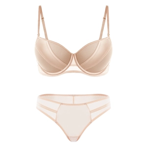 Detail of nude push-up lingerie set with fine mesh cups and hollow strappy briefs