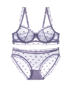 Detailed flat lay of purple lace lingerie set with heart patterns and ruffle edges