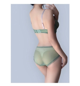 Detail view of mint green mesh lingerie set with back clasp and adjustable straps