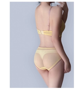 Rear view of light yellow mesh lingerie set with purple straps and sheer details